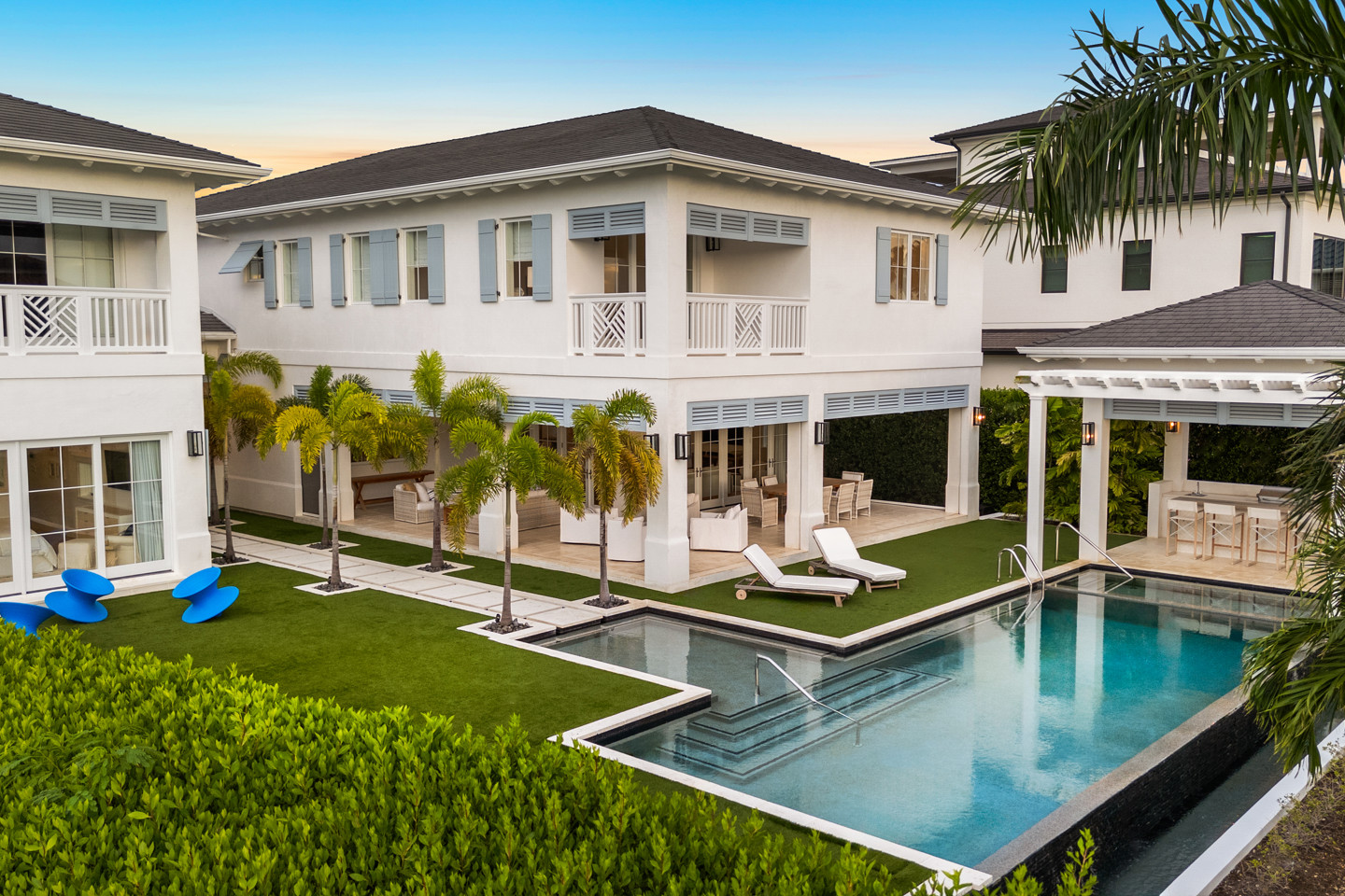 House with art deco furniture and swimming pool with trees