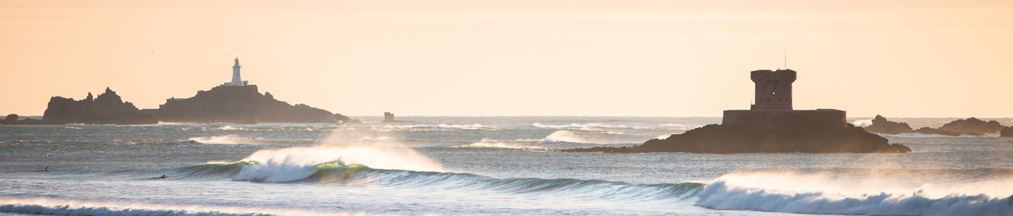 View of La Rocco tower and Corbire lighthouse in Jersey