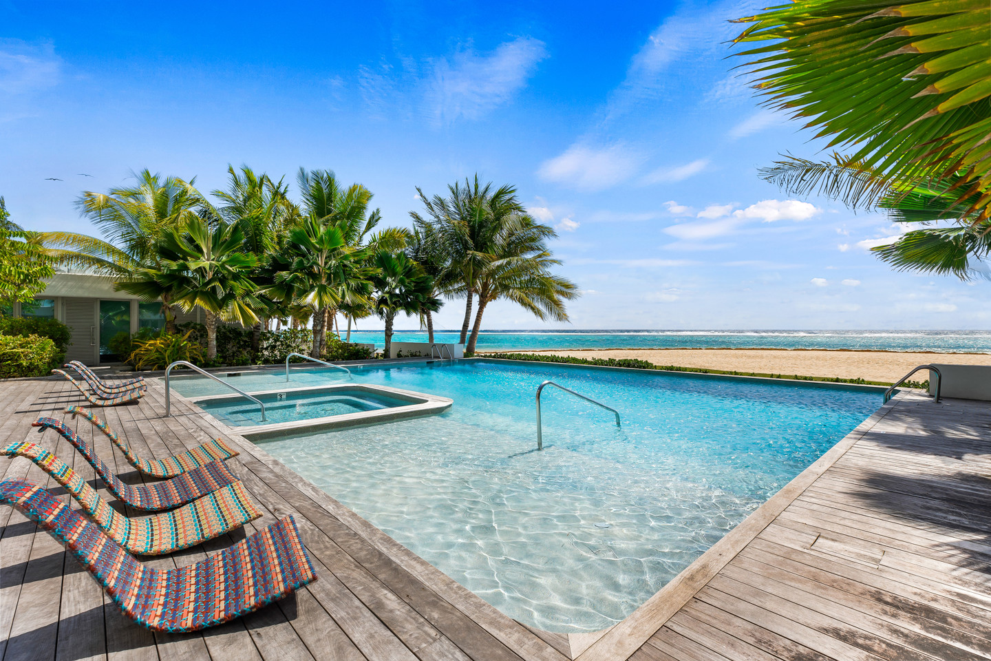 Large Infinity Pool With Palm Trees Blue Sea